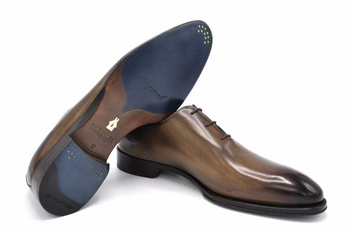 Elegant brown leather dress shoes with polished soles.